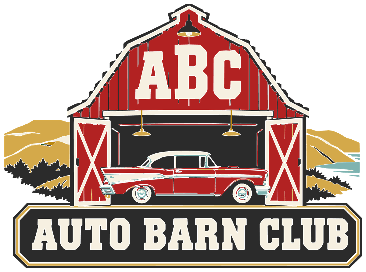 Auto Barn Club: a red barn with a classic car in the open doorway
